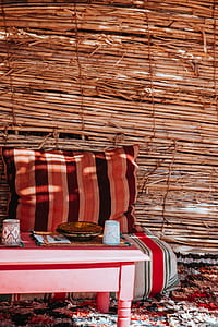 pink wooden coffee table near brown pillow thumbnail