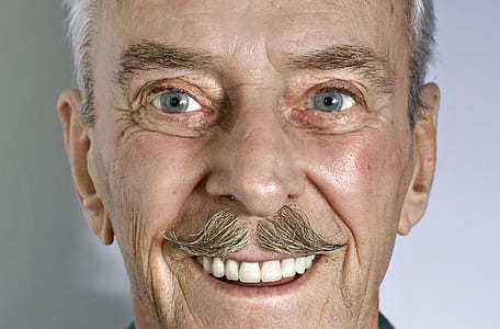 closeup photo of a man smiling thumbnail
