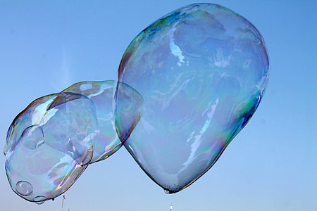 three large bubbles close-up photo during daytime thumbnail