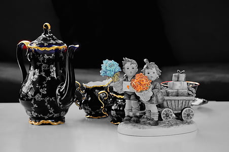 close up photo of figurines and tea set thumbnail