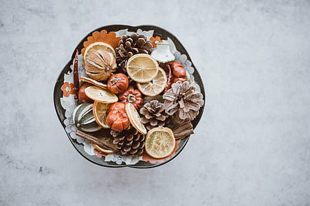 flat lay photo of pine cones and sliced citrus fruits thumbnail