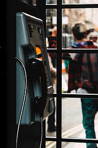 focus photo of gray and black payphone thumbnail