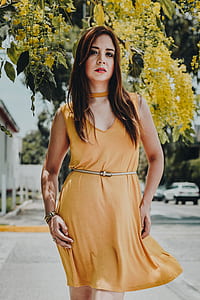 woman posing for photo under trees thumbnail