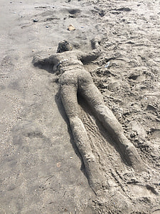 Person With Sand, Face Down On Sand thumbnail
