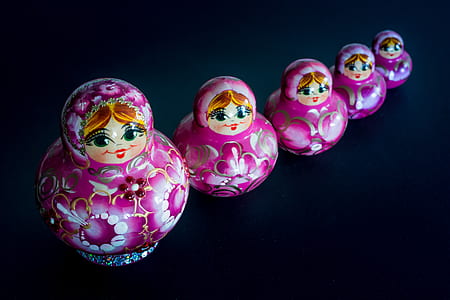 Matryoshka dolls on black surface thumbnail