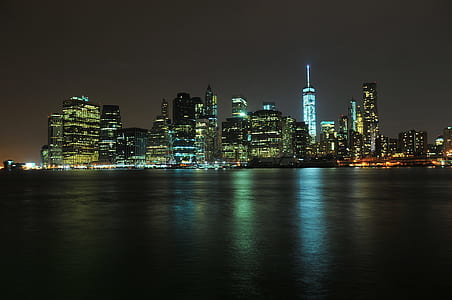 panoramic photography of city buildings at nighttime thumbnail