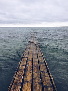 brown wooden dock on body of water thumbnail
