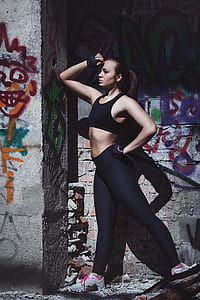 woman in black sport bra and pants posing thumbnail