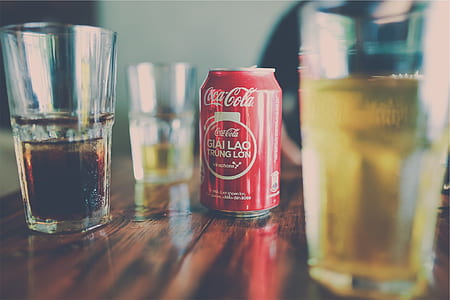 Coca-Cola can beside the clear glass thumbnail