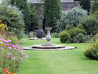 round white concrete floor vase placed on garden thumbnail