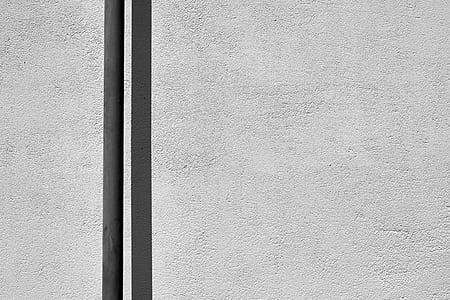 gray pole in front of wall thumbnail