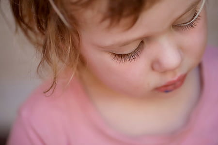 focus photo of girl looking down thumbnail