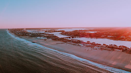 ocean and houses during golden hour thumbnail