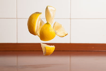 sliced yellow fruits near white wall tiles thumbnail