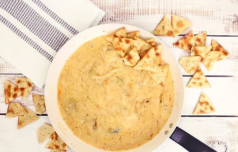 crackers and cheese in bowl on table thumbnail