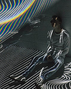man sitting and leaning on wall thumbnail