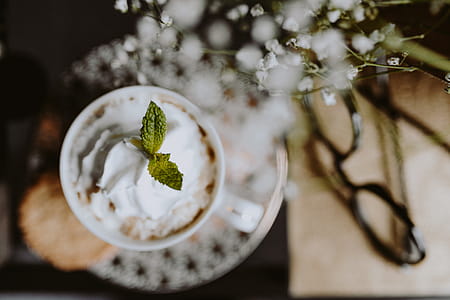 Coffee in a decorative cup with a golden ornament thumbnail