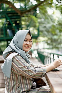 woman sitting outdoors thumbnail
