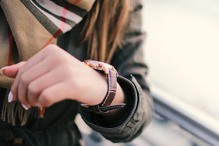 Young woman on the street and detail of fashion watches thumbnail