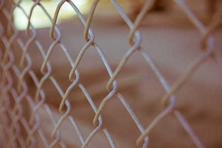 shallow focus photography of cyclone fence thumbnail