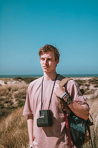 Photography of a Man Carrying Bag thumbnail