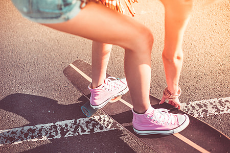 Young Girl with Pink Shoes on Longboard thumbnail