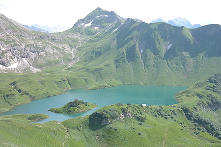 green mountain during daytime thumbnail