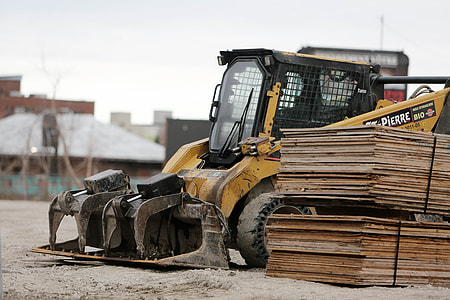 yellow and black skid steer loader thumbnail