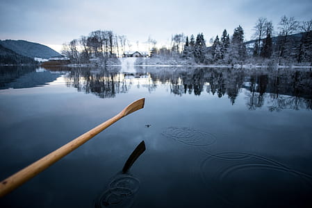 selective color photography of oar over body of water thumbnail
