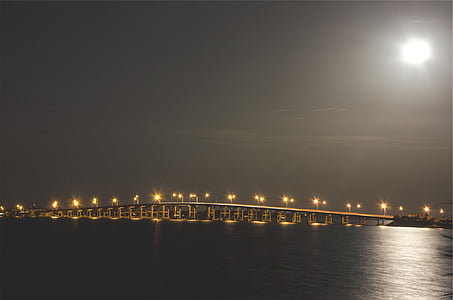 lighted posts on gray metal bridge thumbnail