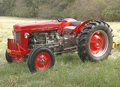red tractor on green grass thumbnail