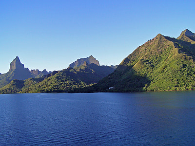 green mountain range near body of water thumbnail