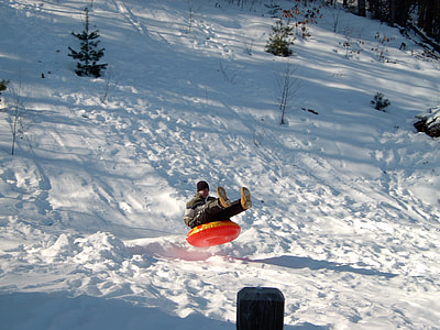 mas riding inflatable tube sliding on snow thumbnail