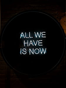 White All We Have Is Now Neon Signage on Black Surface thumbnail