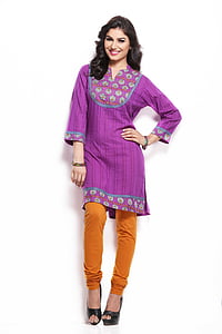 woman standing while holding her waist posing thumbnail