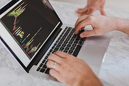 person using silver MacBook thumbnail