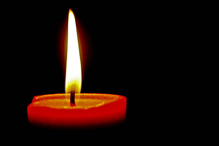 lighted red pillar candle thumbnail