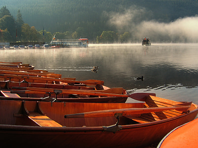 brown sailing boats on clear river thumbnail