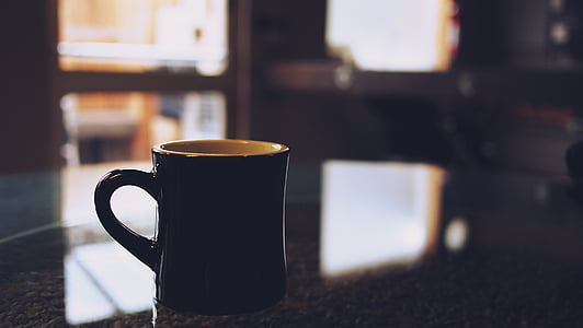 selective focus of black ceramic mug thumbnail