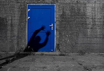 person's shadow on door thumbnail