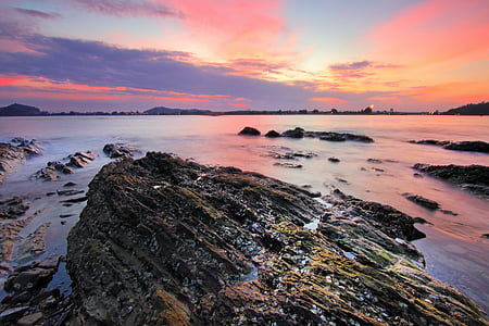 coastal stack and rocks during golden hour thumbnail