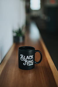 black Black Ring coffee ceramic mug on brown wooden table thumbnail