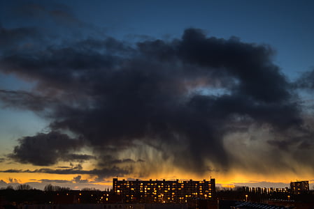 brown building under gray clouds during golden hour thumbnail