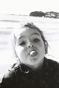 grayscale photography of girl with tongue out thumbnail