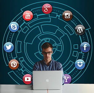 man in front of MacBook thumbnail