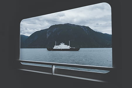 black and white ship on body of water thumbnail