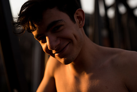 man smiling while taking selfie thumbnail