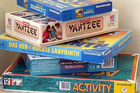 stack of assorted-brand board game boxes thumbnail