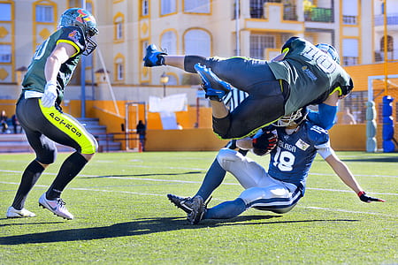 three football players on field thumbnail