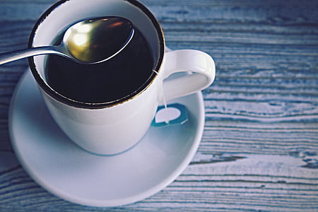 white ceramic mug on top of saucer plate thumbnail